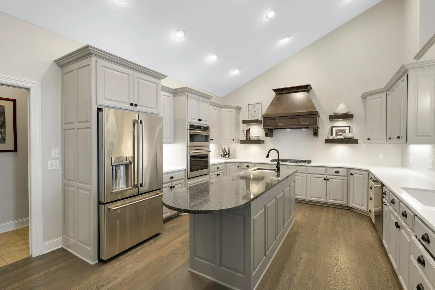 New appliances, custom alder hood vent and floating alder shelves, and custom backsplash