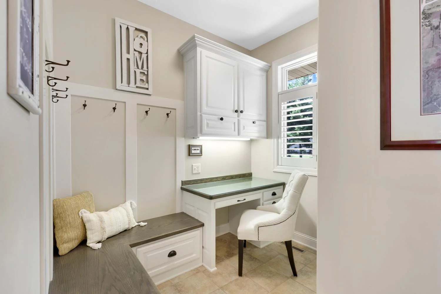 Mud room with custom boot bench, built ins cabinets and kitchen planning space
