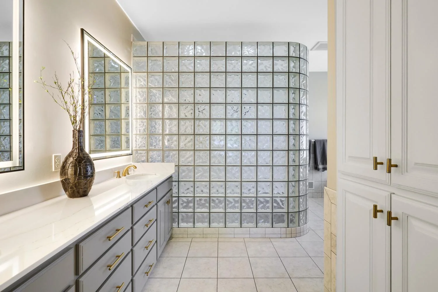 Owners en suite includes and 9 ft vanity with Cambria vanity top and brushed gold detail