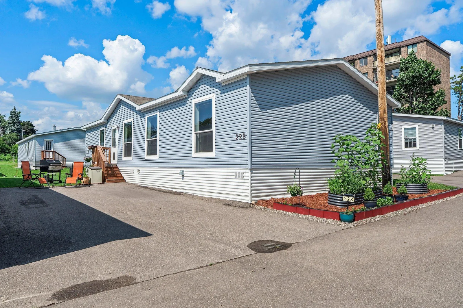 This unit also features a coveted 4-car parking pad. Additional upgrades include a water softener installed in 2023 and two EV charging outlets—standard charging added in 2022 and a fast-charging outlet installed in 2024.