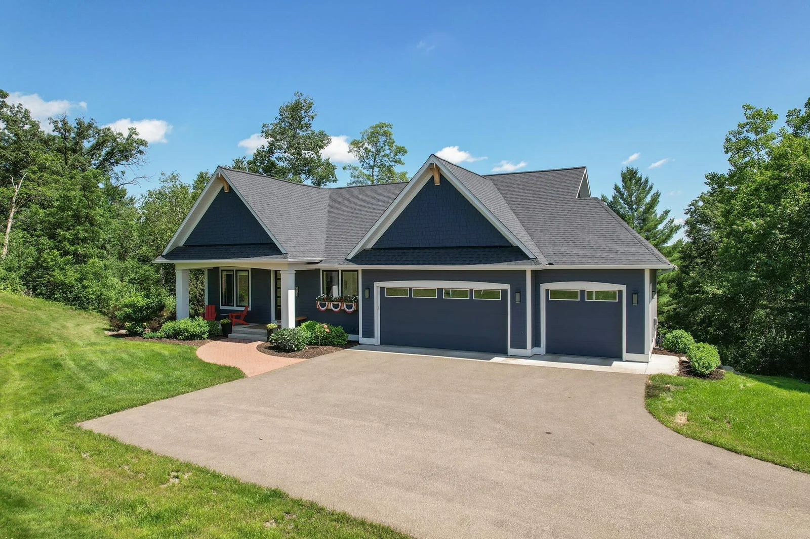 3 car attached garage is heated and has electric car chargers