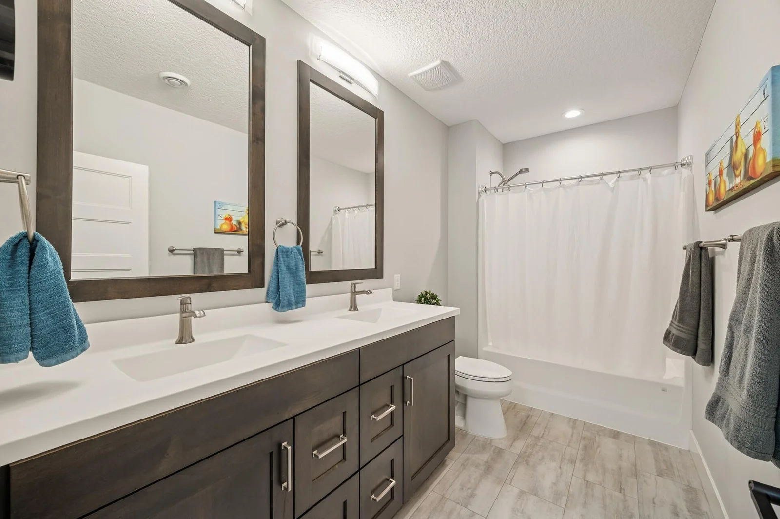 Lower level full bath with dual sinks and 39" counters