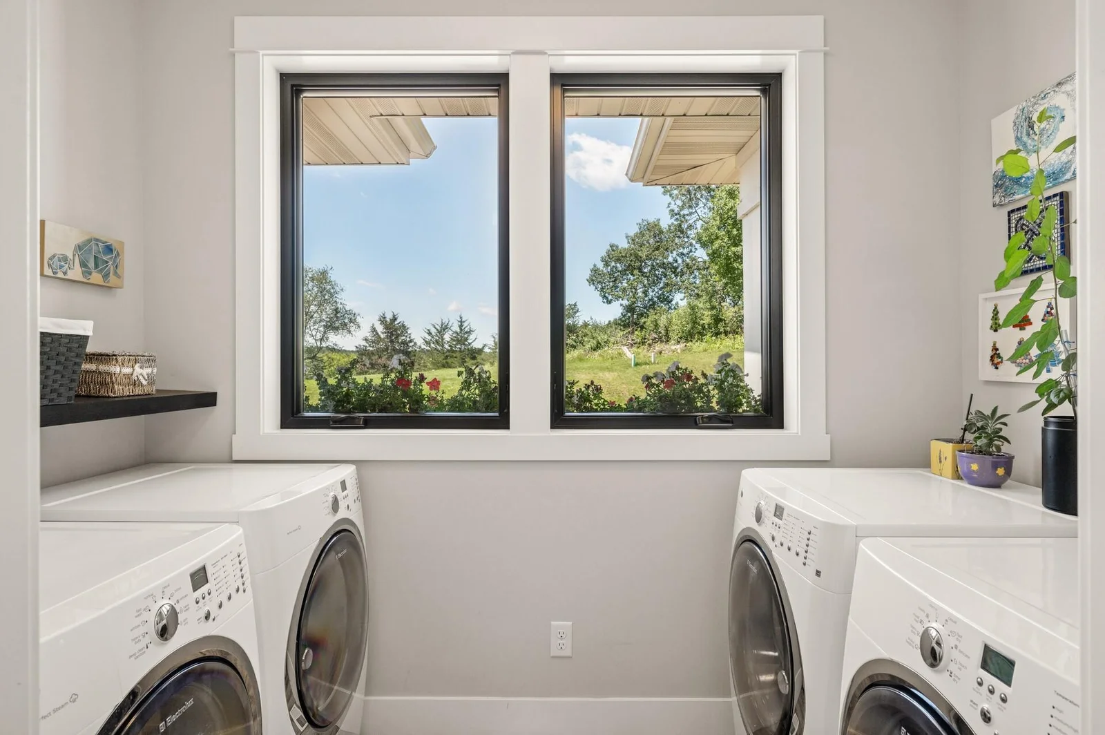 Main floor laundry set up for dual washers and dryers.
