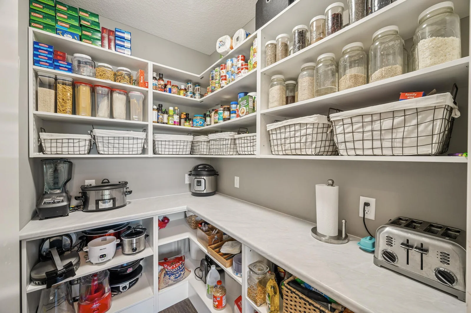 Large pantry with electric for all your accessory appliances and storage needs