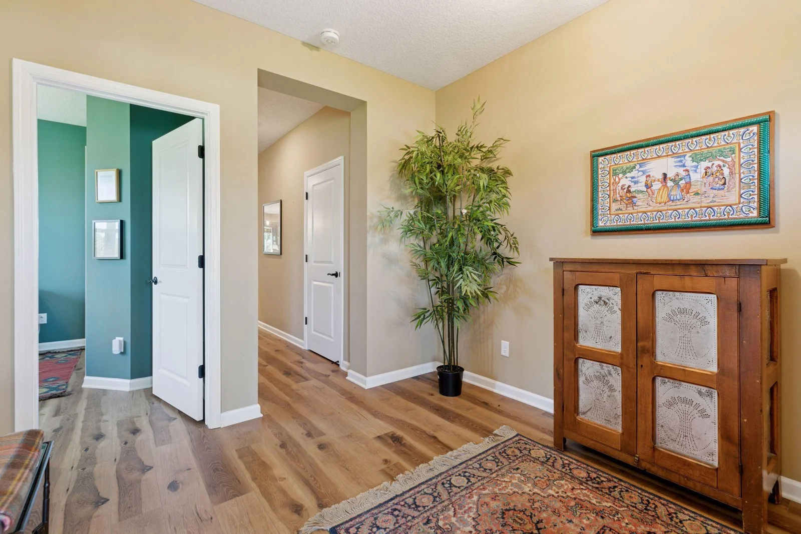 Beautiful flooring leads to the main living area.