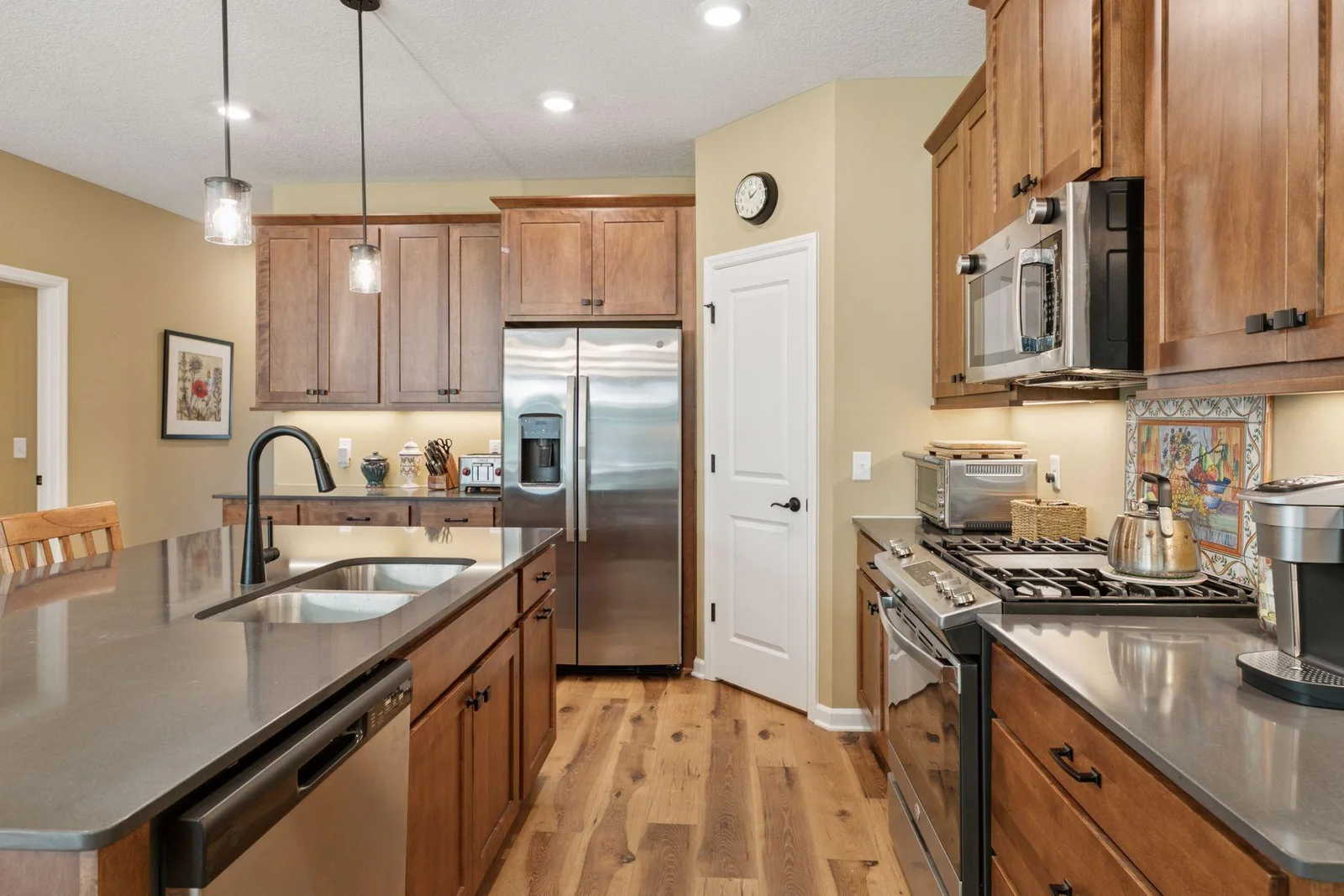 Stainless steel appliances including gas range.