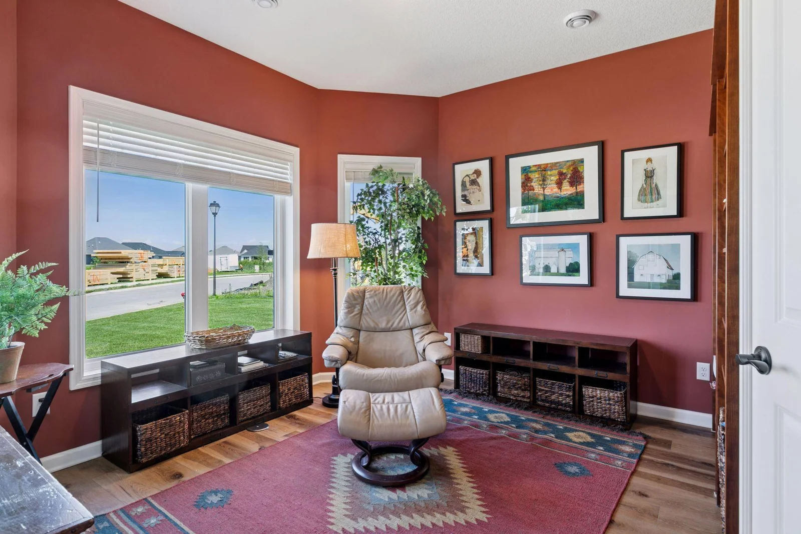 Convenient den overlooking the lovely front yard.