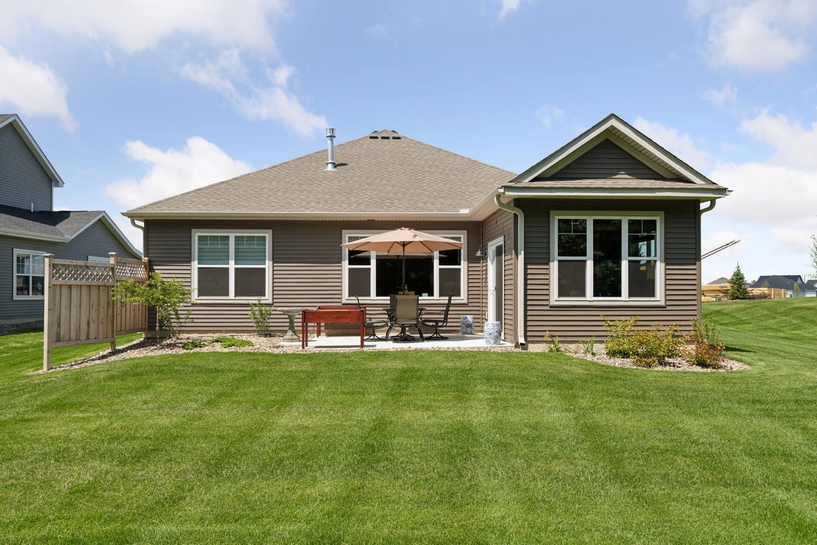 Patio and small privacy fence create a private retreat.