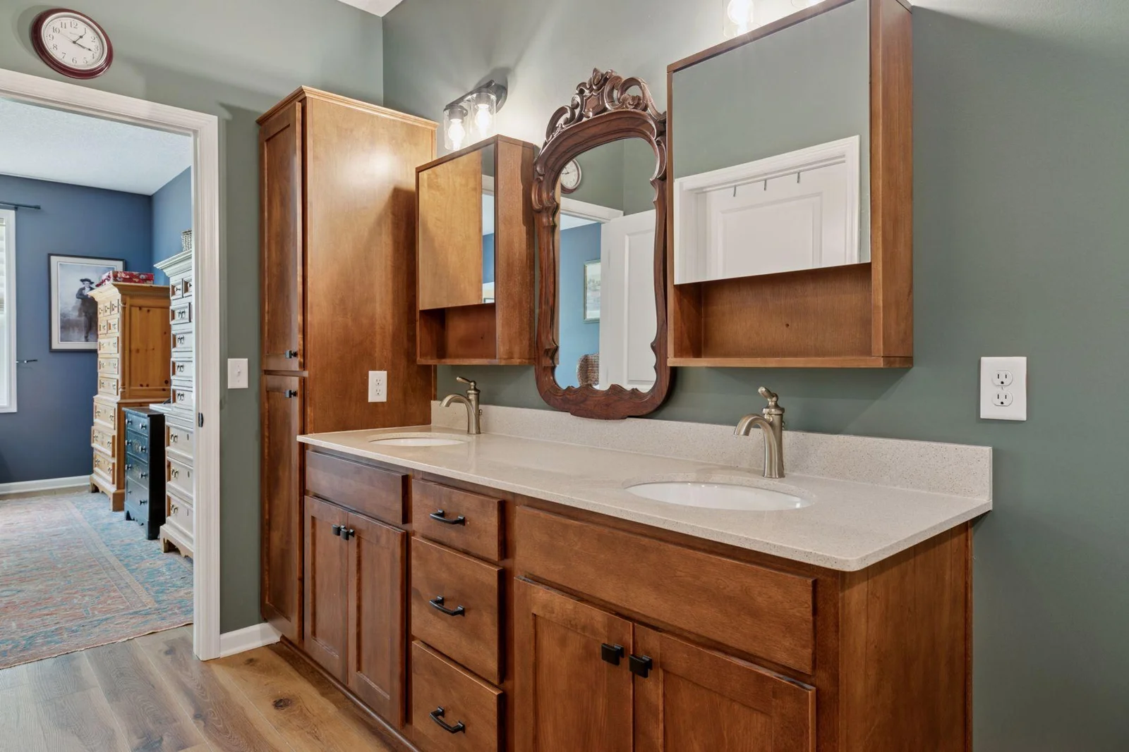 Dual vanity with spacious linen closet and a drawer stack for your daily convenience.
