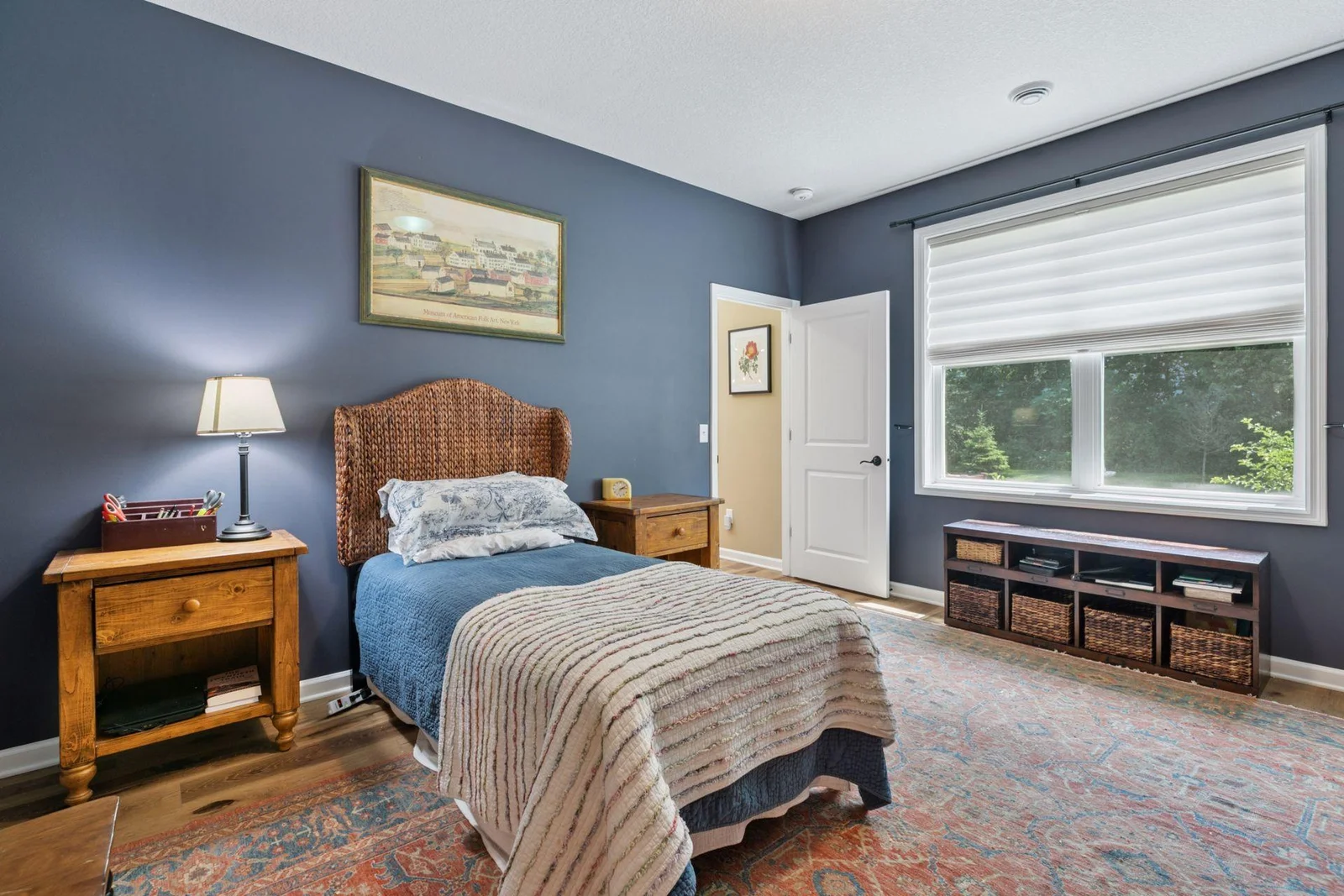 Primary bedroom - this bed is on the smaller wall - King size bed will easily fit in this room.