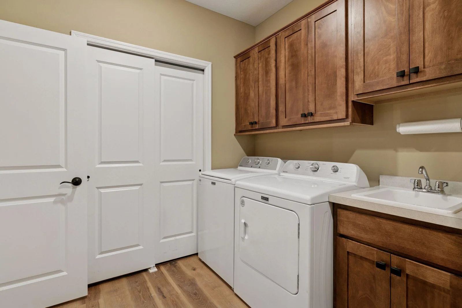 Very spacious back entry with convenient laundry and sink.
