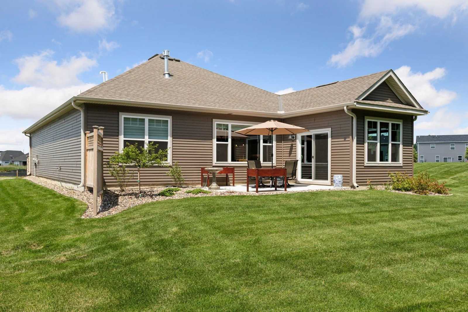 Side view of property shoing the landscaping and size of patio.