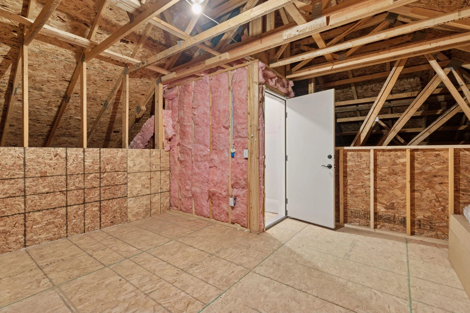 Upper level storage, access staircase from garage.