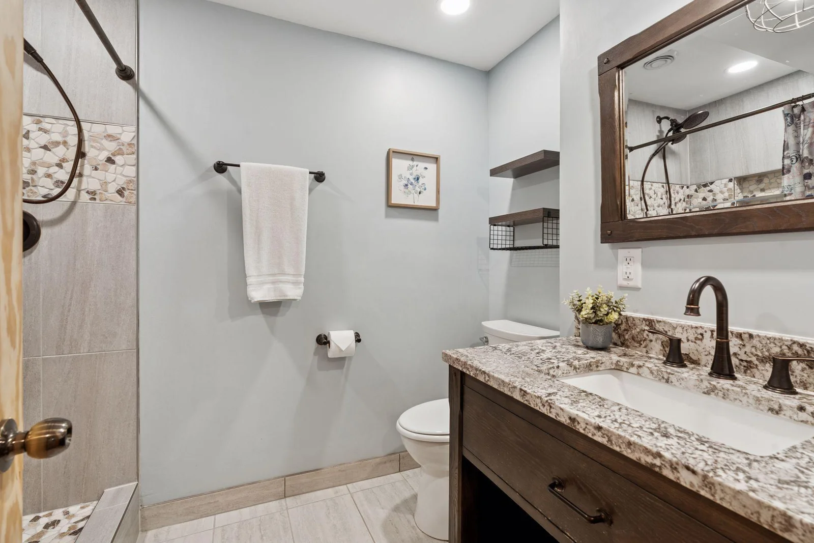 Lower level 3/4 bath with ceramic tile shower
