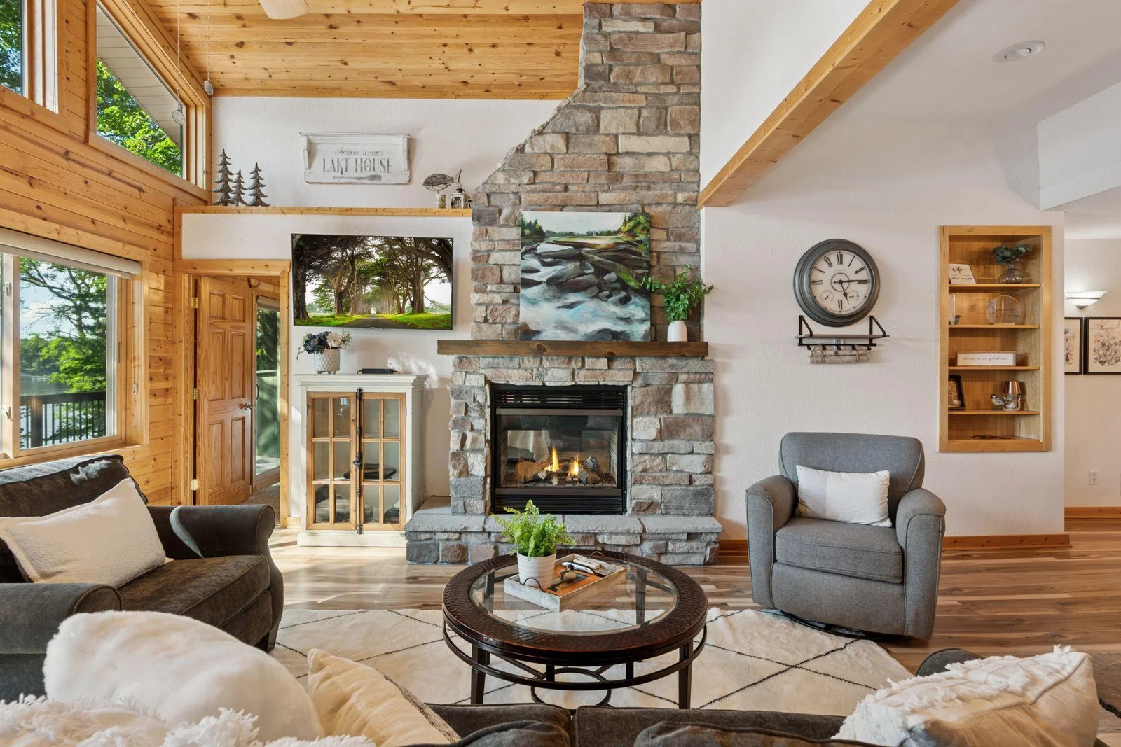 Double sided fireplace with stone surrouond