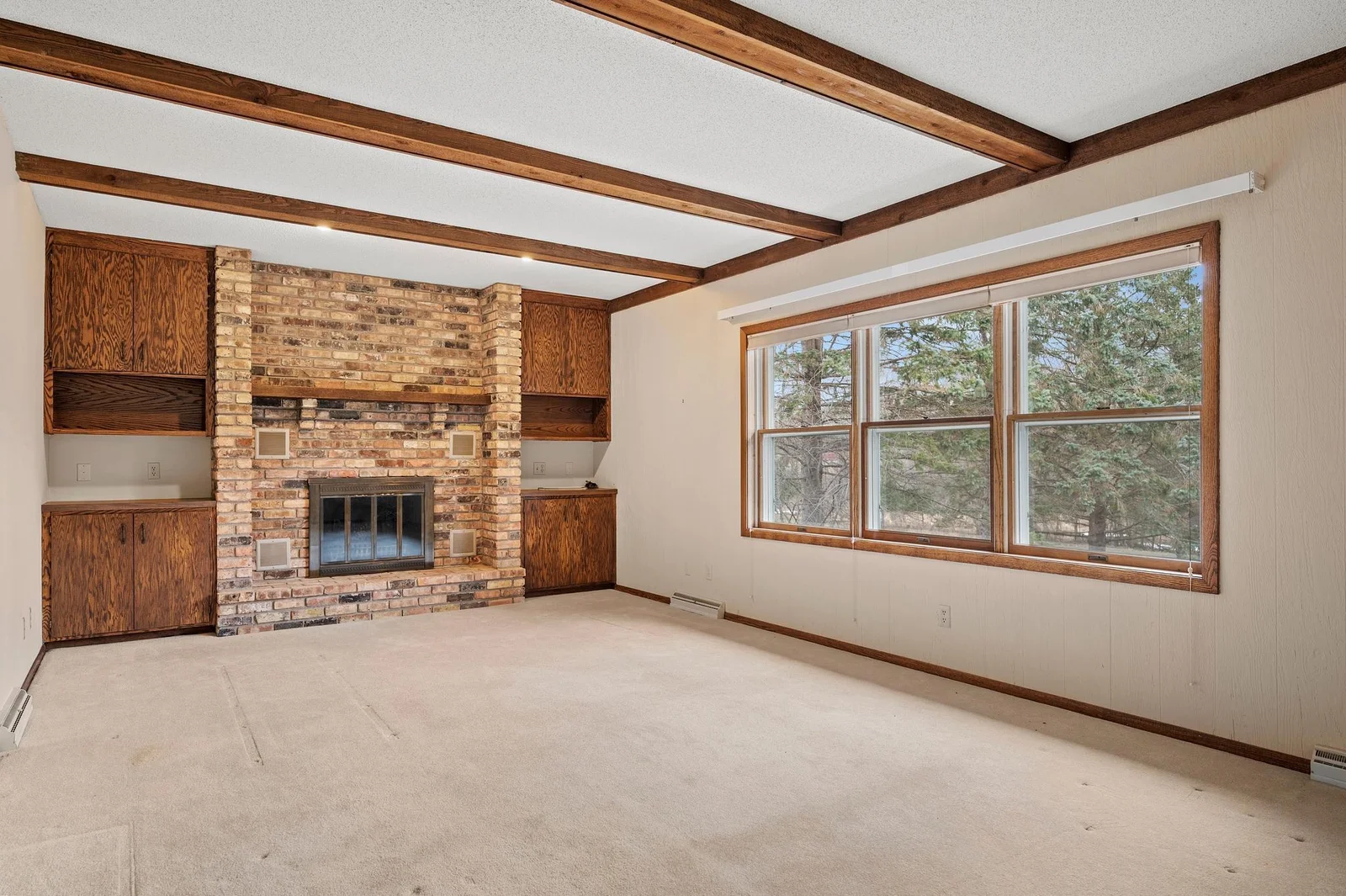 Tons of natural light and beautiful views of the park like back yard from this main floor family room off the dining area.