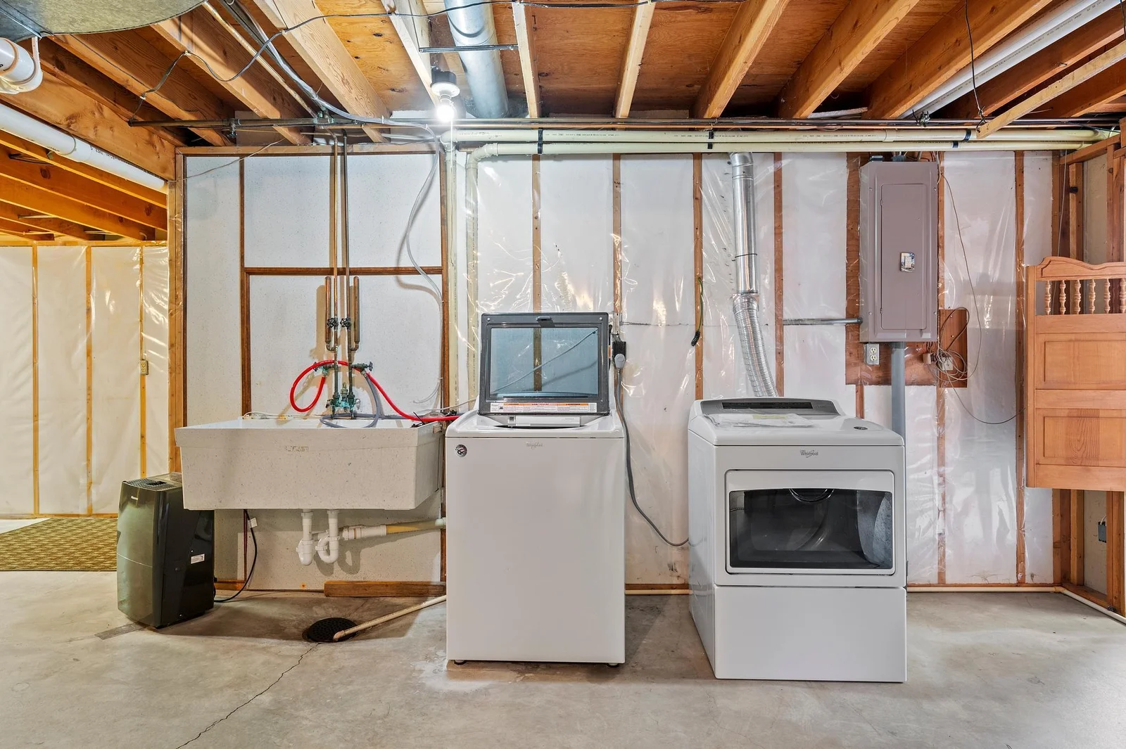 Washer and dryer conveniently located just off the family room in the lower level.
