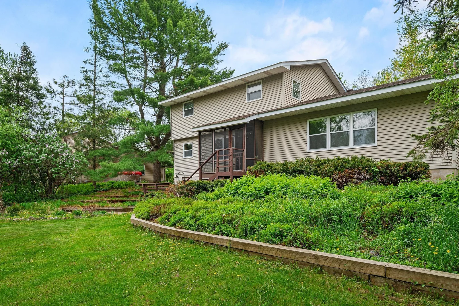 Deck overlooks a peaceful green space