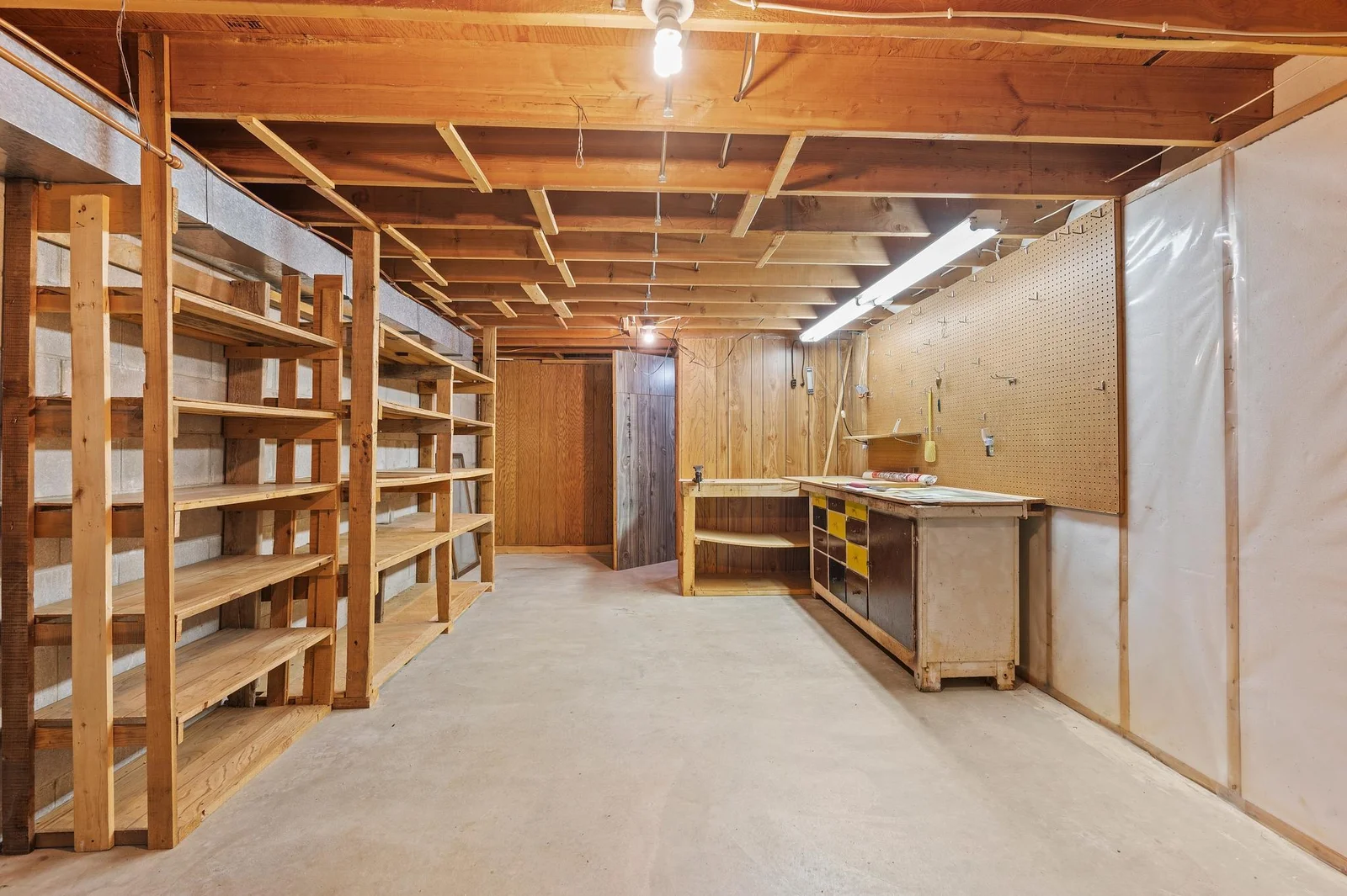The lower level also features this spacious storage room work shop aea.  Or finish it off as an office or bonus area!