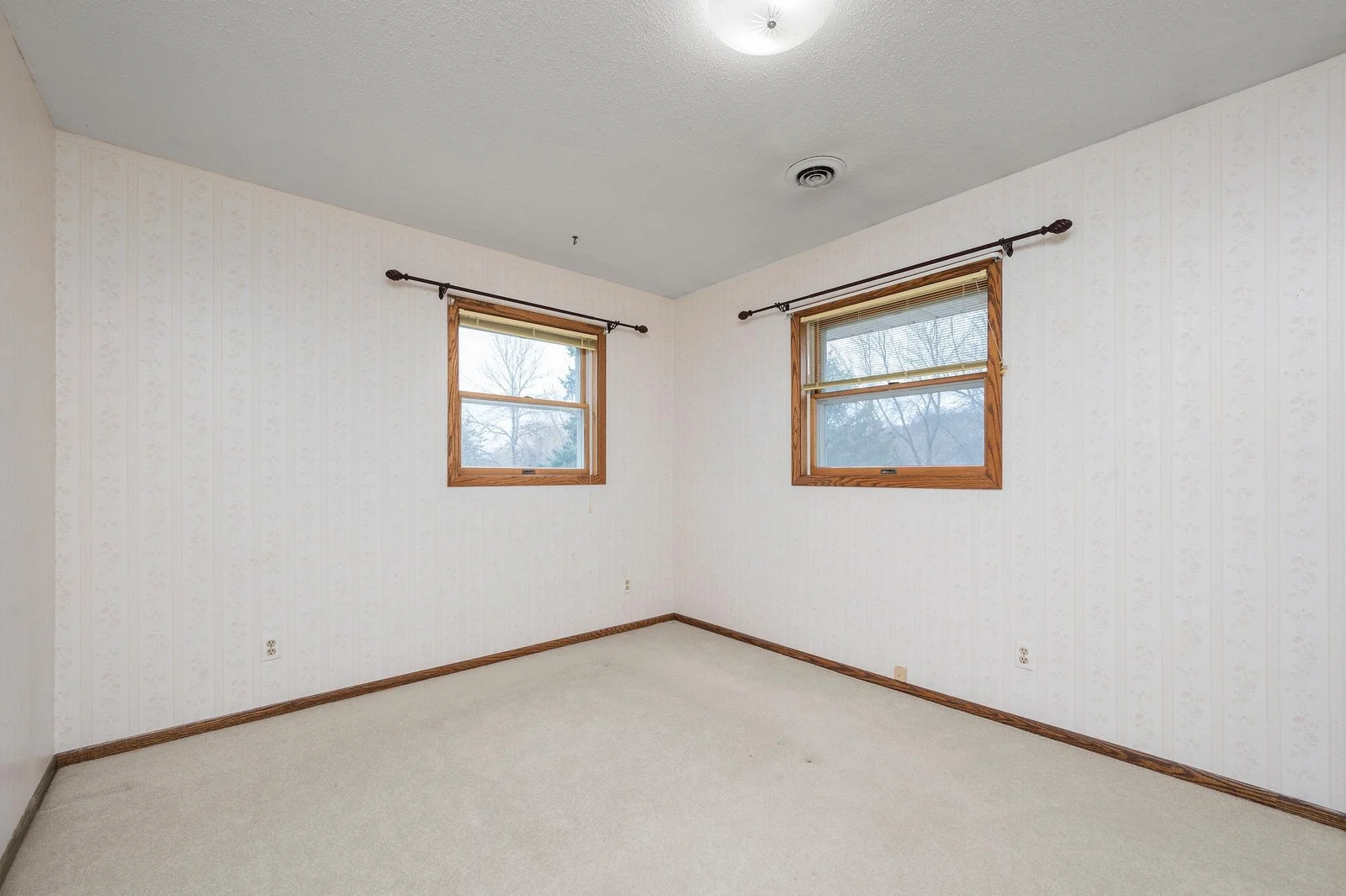 The third bedroom on the upper level also boasts beautiful treetop views of the yard.