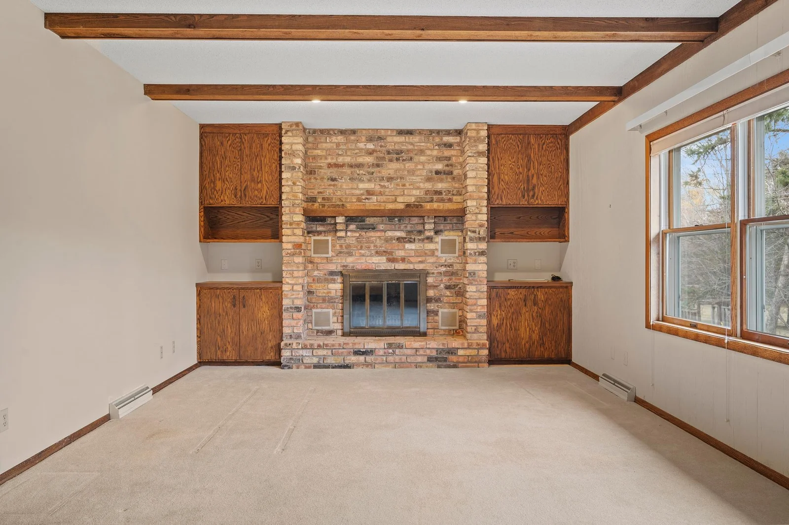 This home features a wood burning fireplace surrounded by great storage for cozy evenings in the colder months.