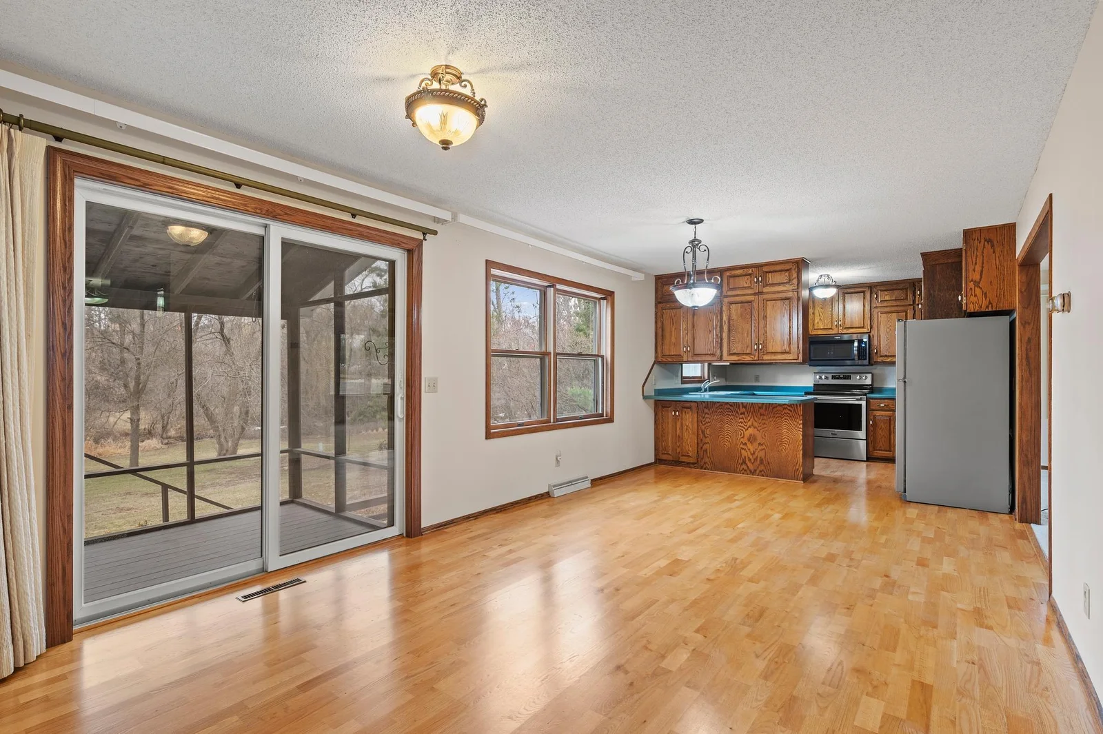Very large dining area with a beautiful screened in porch for additional outdoor dining!