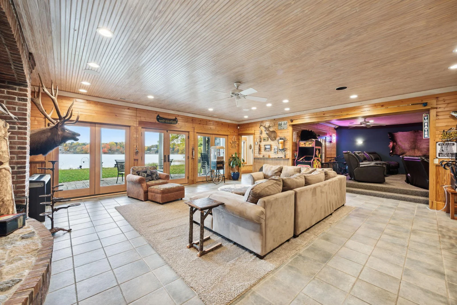 The spacious walk-out lower level offers ideal entertaining space, featuring heated tile floors, 9-foot ceilings, and expansive lake views.