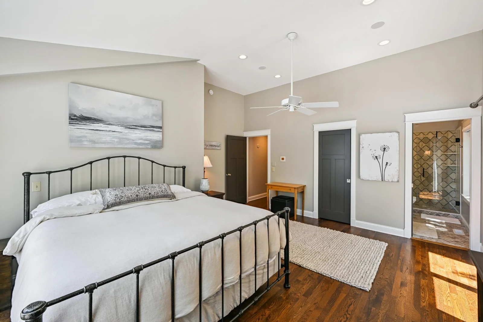 This spacious bedroom suite is nearly 400 sq ft with rich hardwood floors and updated windows and doors, offering comfort, style, and plenty of natural light in this luxury lakeside retreat.