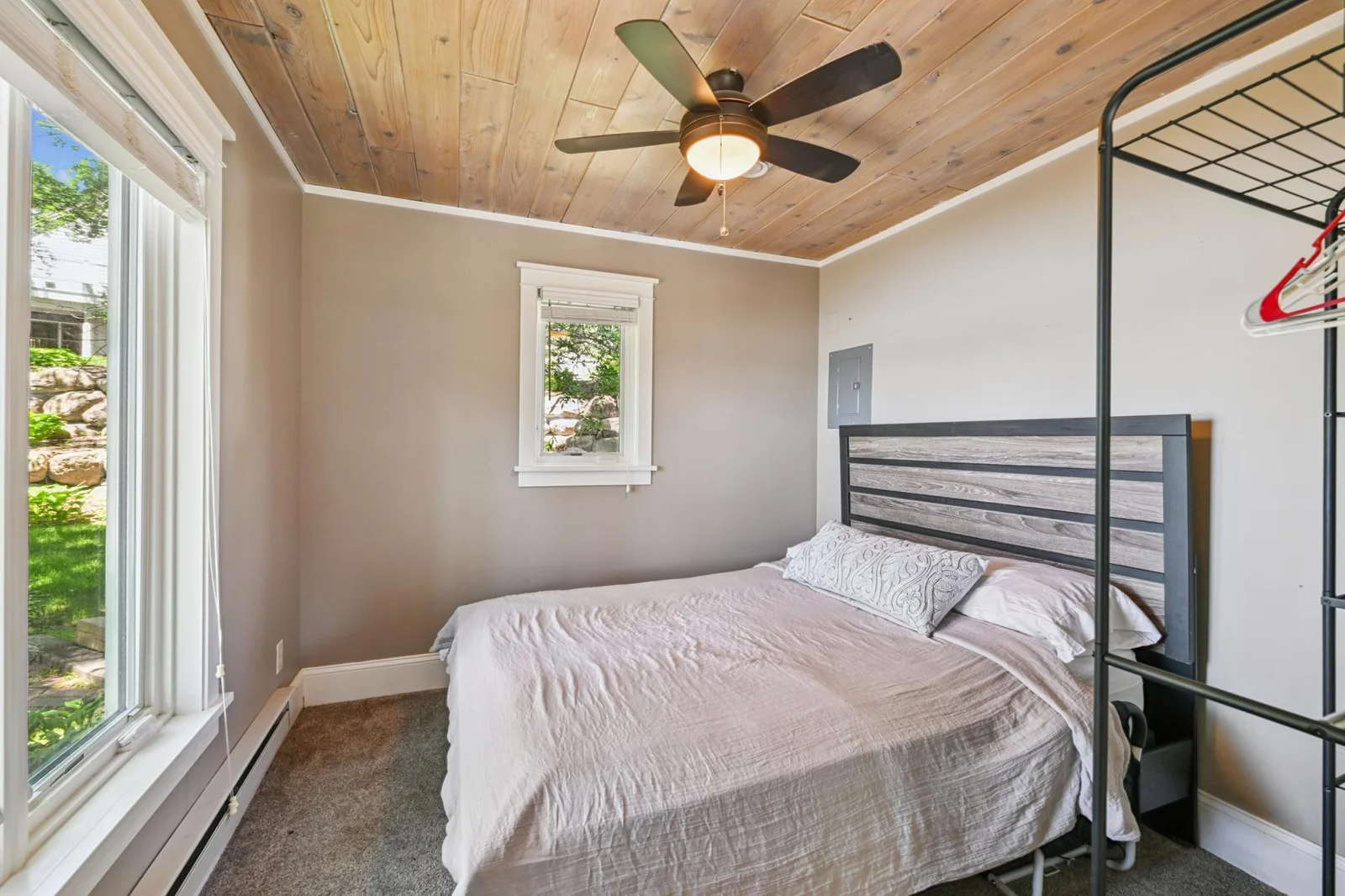The guest cottage bedroom offers phenomenal views looking out over West Lake Sylvia. This building has its own furnace/ac, water heater and softener along with baseboard electric & the fireplace as supplemental heat sources.