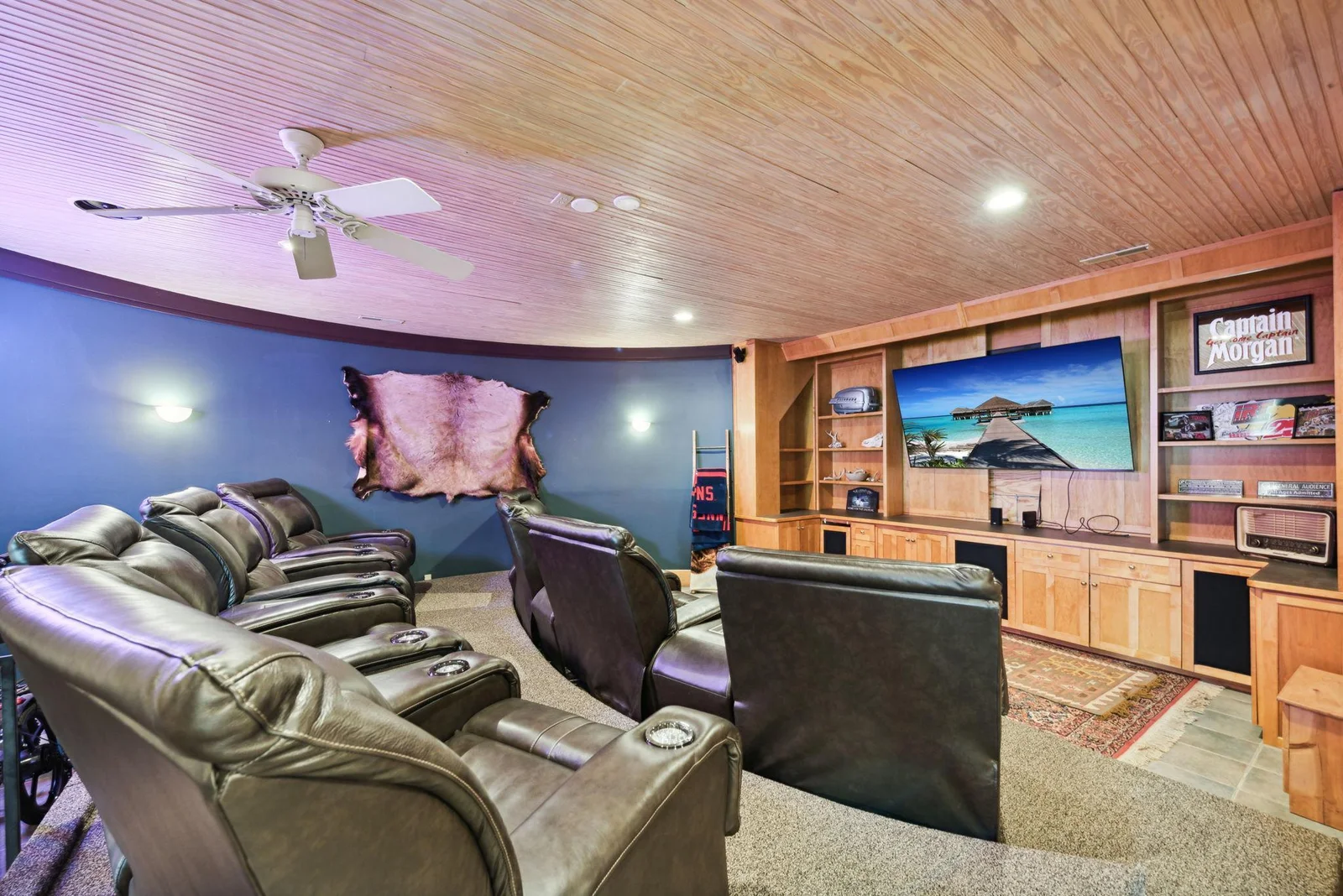 Enjoy a true home theater experience in this custom-designed media room, featuring tiered seating and built-in cabinetry for your entertainment center.  Perfect for movie nights or game day gatherings.