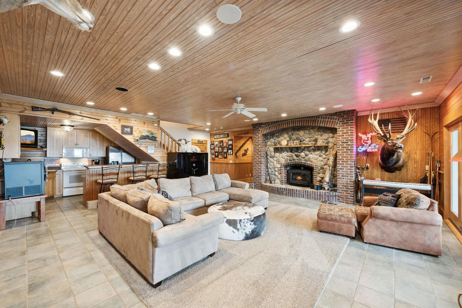 Just off the walk-out lower-level living room, a full kitchen with bar seating offers the ideal setup for lakeside entertaining and hosting guests with ease.
