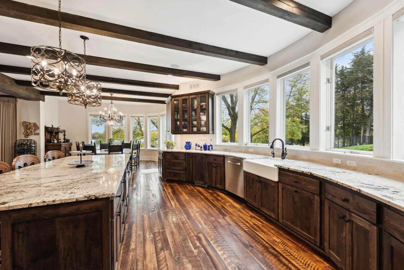 The farmhouse sink offers views of the paver patio and fenced in yard, ideal for kids or pets. This beautifully updated home is move-in ready to enjoy lakeside living on Lake Sylvia.