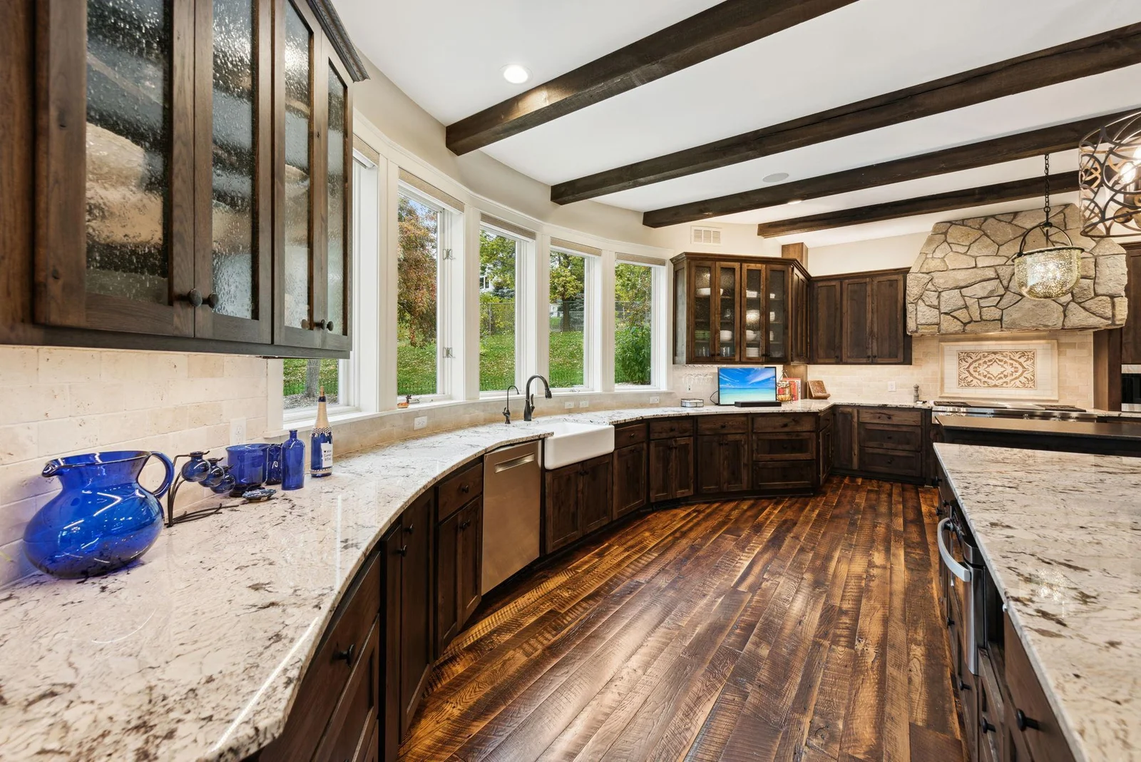 Enjoy crystal-clear water from the farmhouse sink with a dedicated reverse osmosis system, paired with a whole-home Kinetico water filtration system, all in a beautifully updated kitchen with serene views.