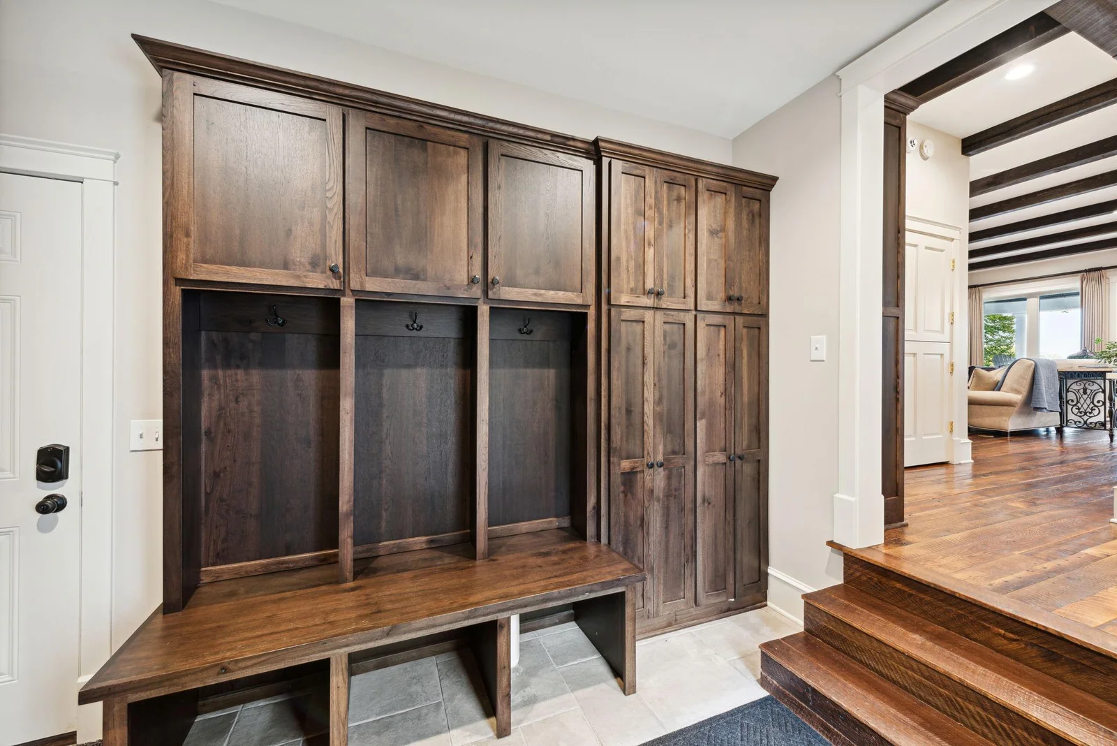Entering from the garage, you'll love the custom built-in lockers and cabinetry for organized, everyday living with ample storage for coats, gear, and more.