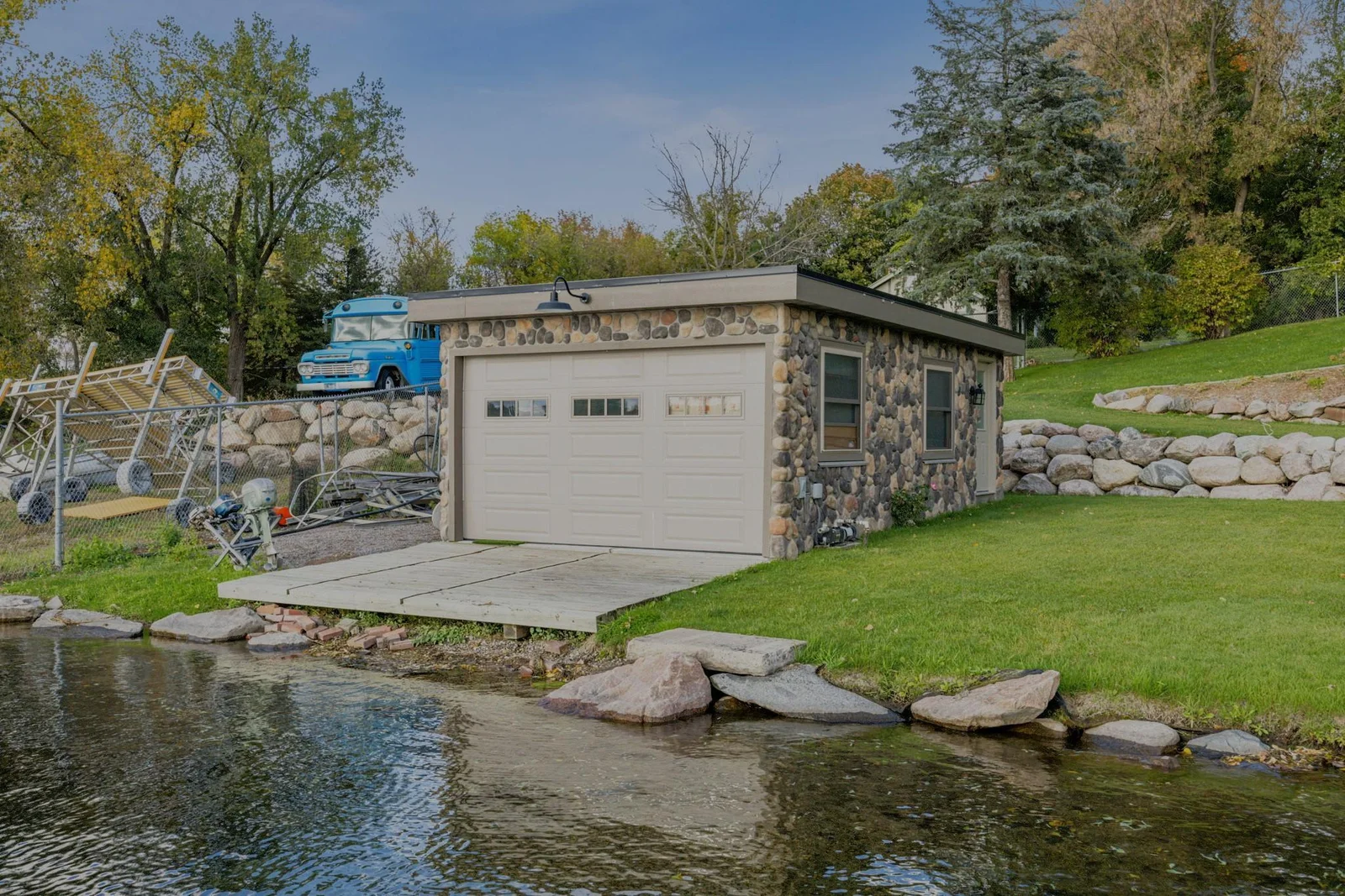 This 25x15 boathouse sits right at the water’s edge, an increasingly rare find. Offering endless possibilities for lakeside entertaining, storage, or hobby space.