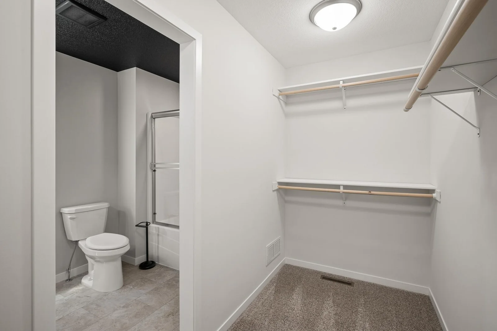 Primary bedroom walkin closet to private bath.