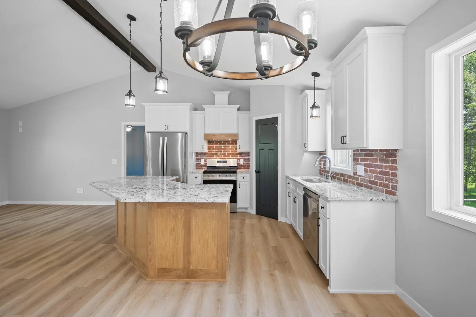 The perfect blend between enameled, oak cabinetry and lighting!