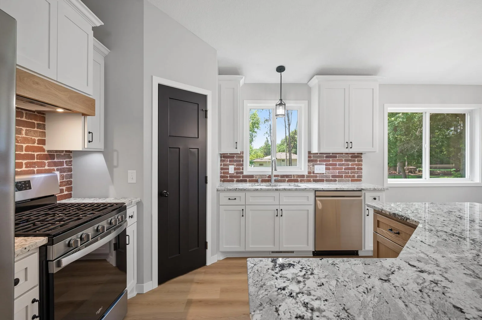 Enameled perimeter cabinets and tile backsplash!
