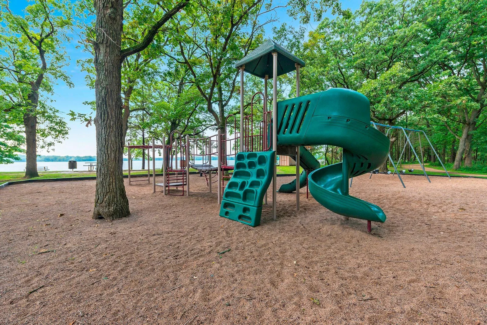 Pleasant Lake Playground with picnic area and private beach.