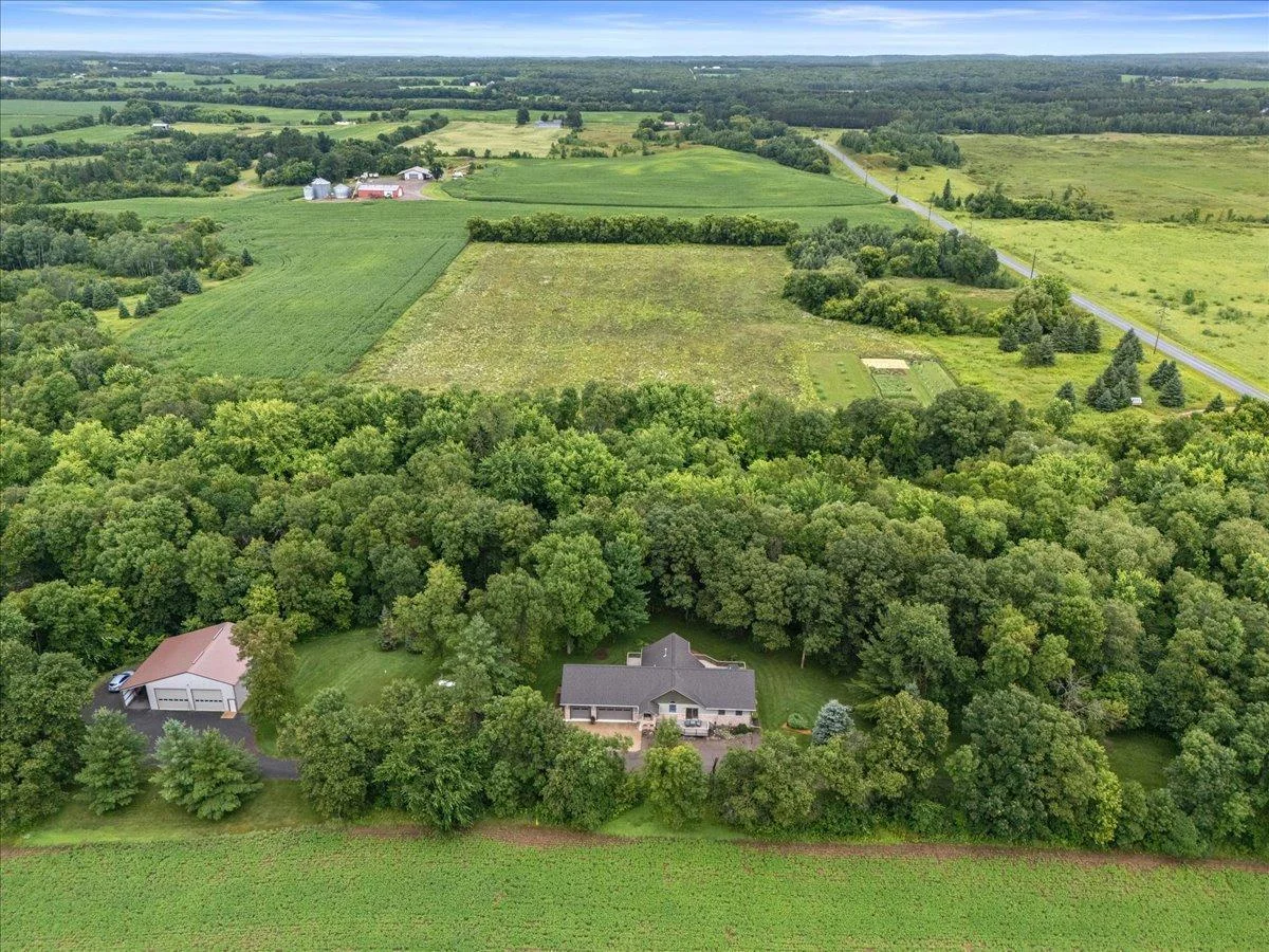 Surrounded by trees, fields and acres of DNR land across the street.