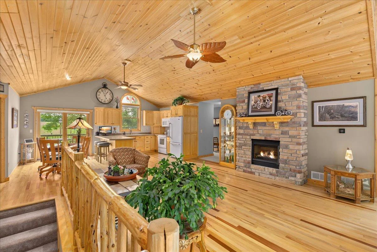 Gorgeous brick fireplace offers warmth and ambiance on chilly evenings.
