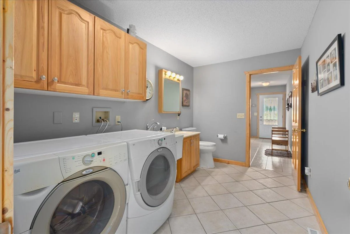 Main level laundry with additional sink and toilet!