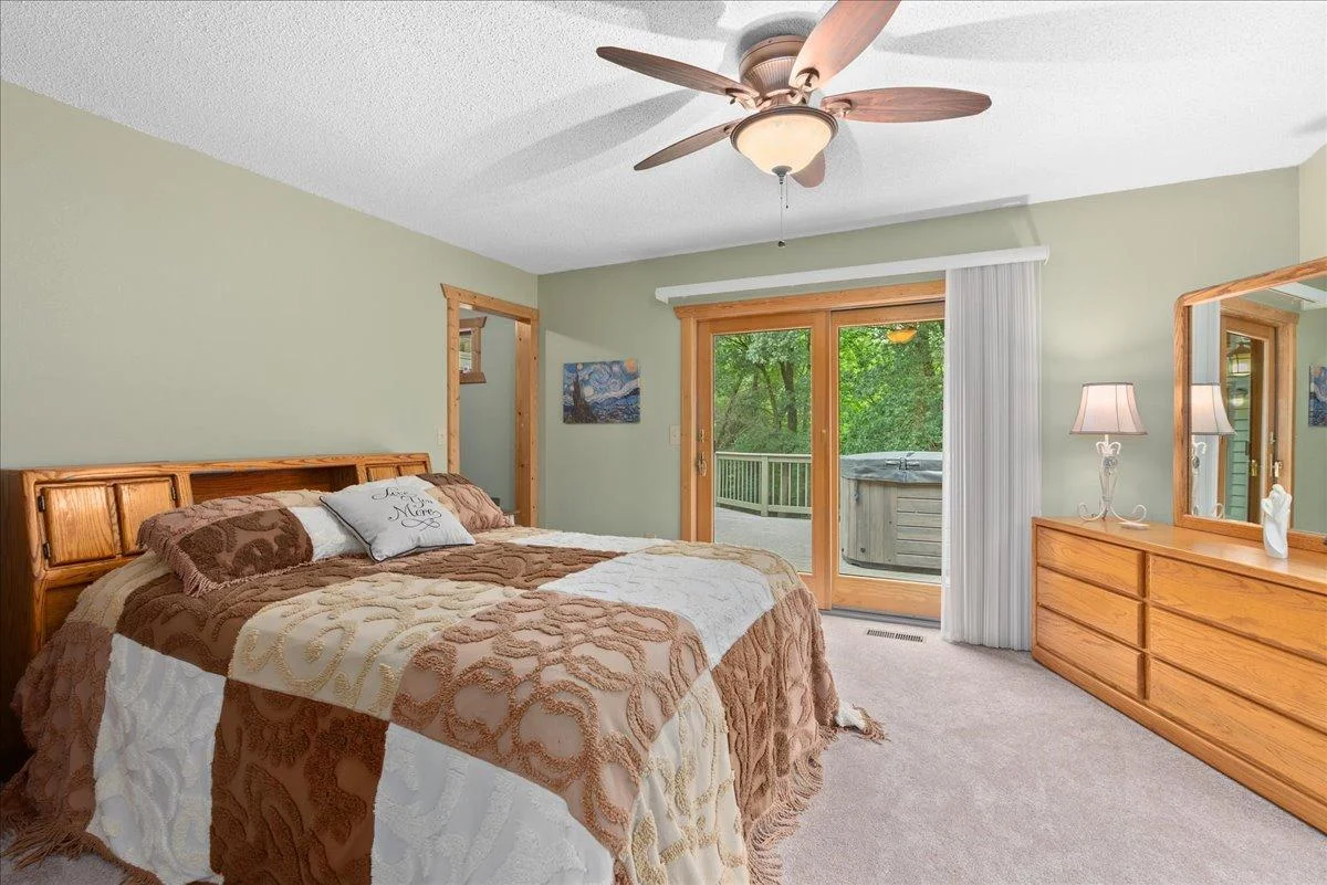Main level primary suite with access to the large back deck.