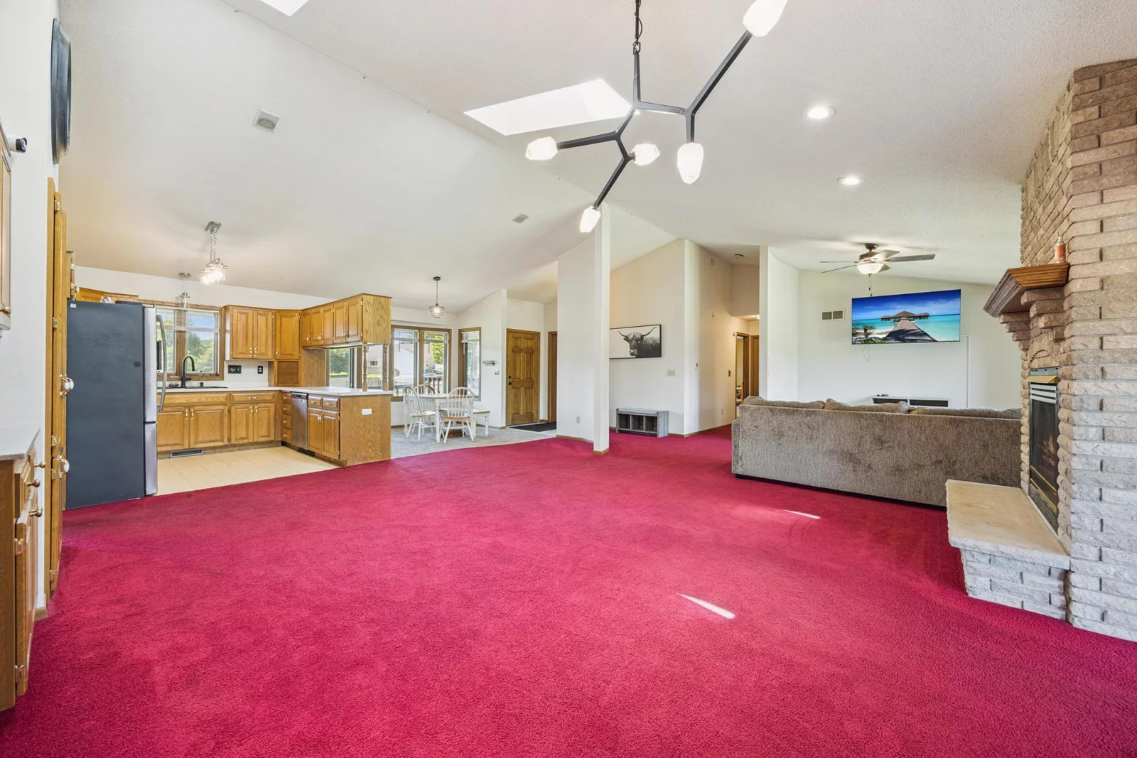 Open concept - kitchen 2 dining areas and living room with fireplace