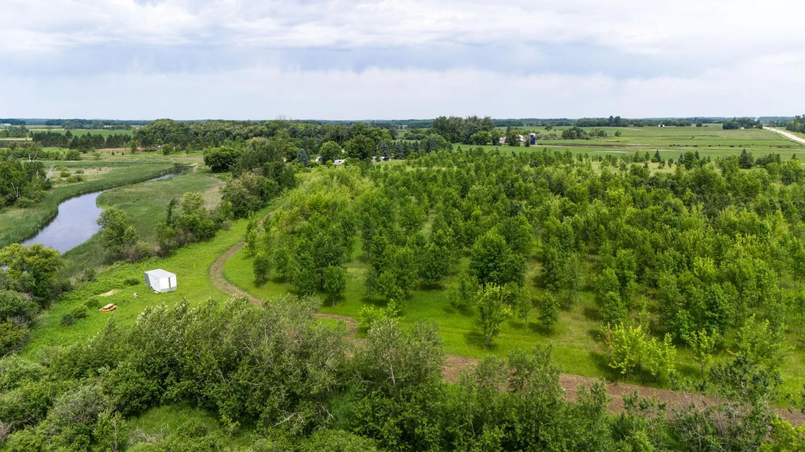 7.39-Acre Lot on the Long Prairie River! Discover your own private escape with 7.39 acres of beautiful land along the Long Prairie River.