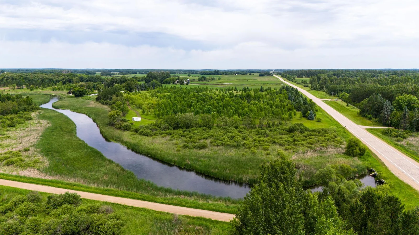 7.39-Acre Lot on the Long Prairie River! Discover your own private escape with 7.39 acres of beautiful land along the Long Prairie River.