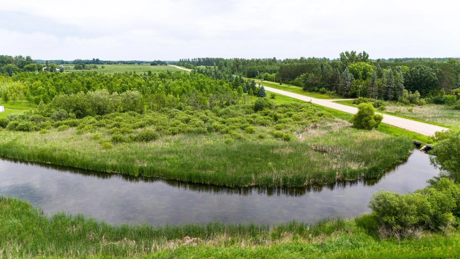 7.39-Acre Lot on the Long Prairie River! Discover your own private escape with 7.39 acres of beautiful land along the Long Prairie River.