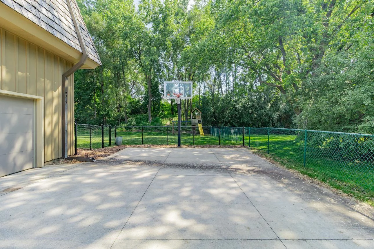 Driveway with basketball hoop