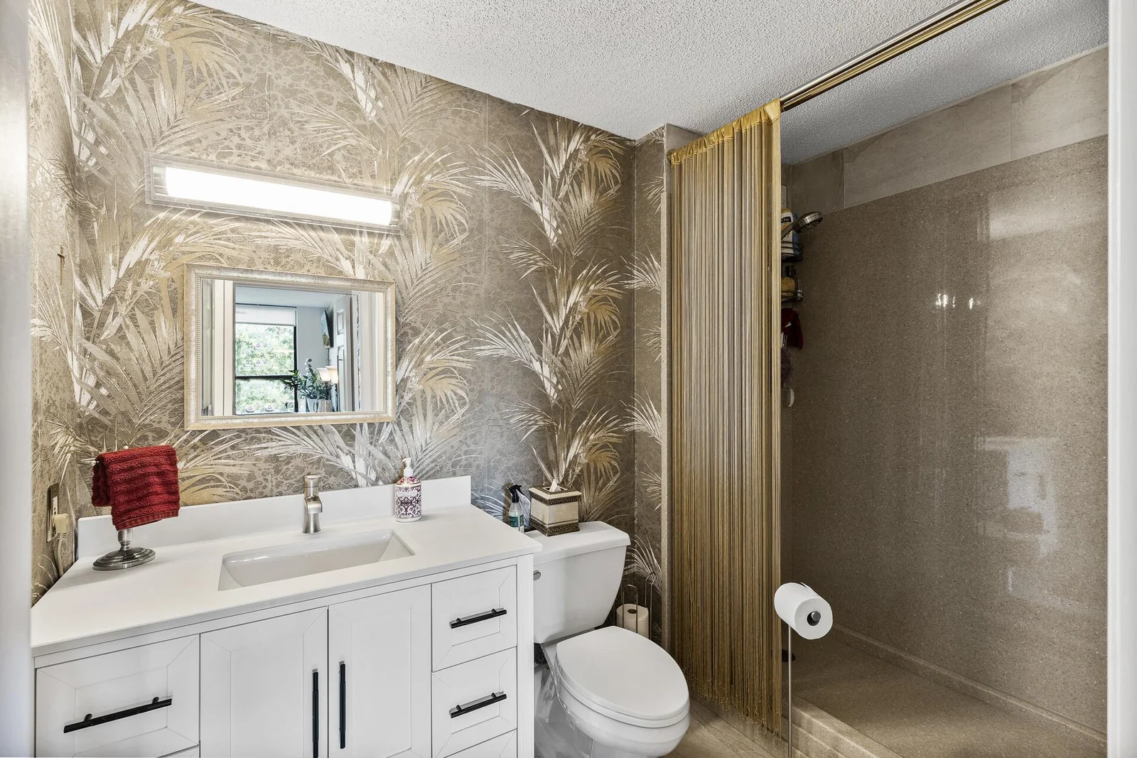 New bath with Onyx shower surround, tile floor and enameled vanity.