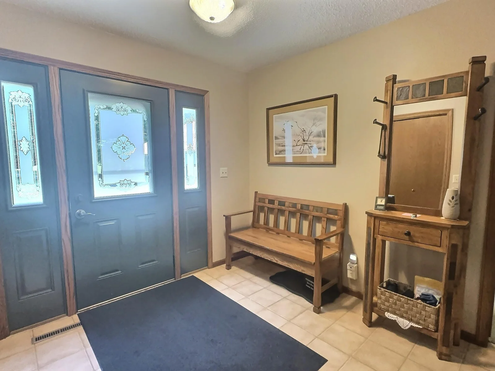 Another view of the entryway.  Front loading washer and dryer are located in the closet.
